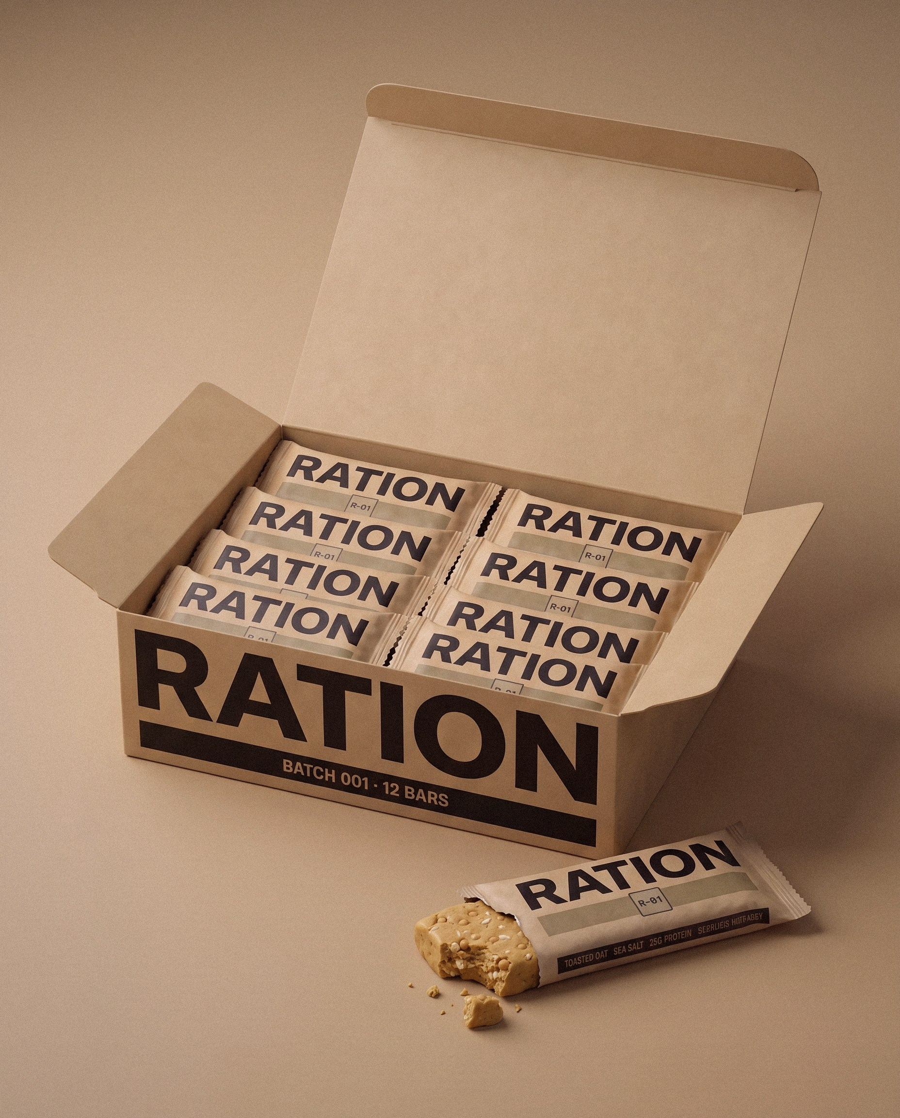 Studio render: an open kraft shipping box printed with the RATION wordmark and BATCH 001, holding twelve wrapped bars in two rows.